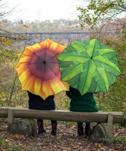 grön paraply med solros design i naturinspirerad stil